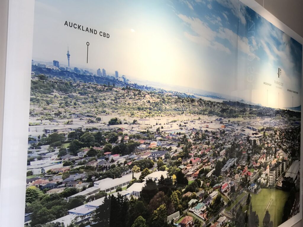 Large aerial photo print on a sales suite wall