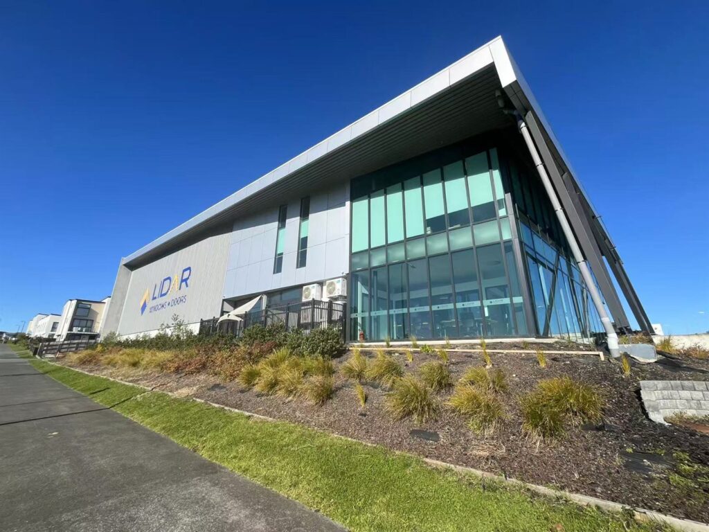 Building signage across a commercial facade, installed by Signmate