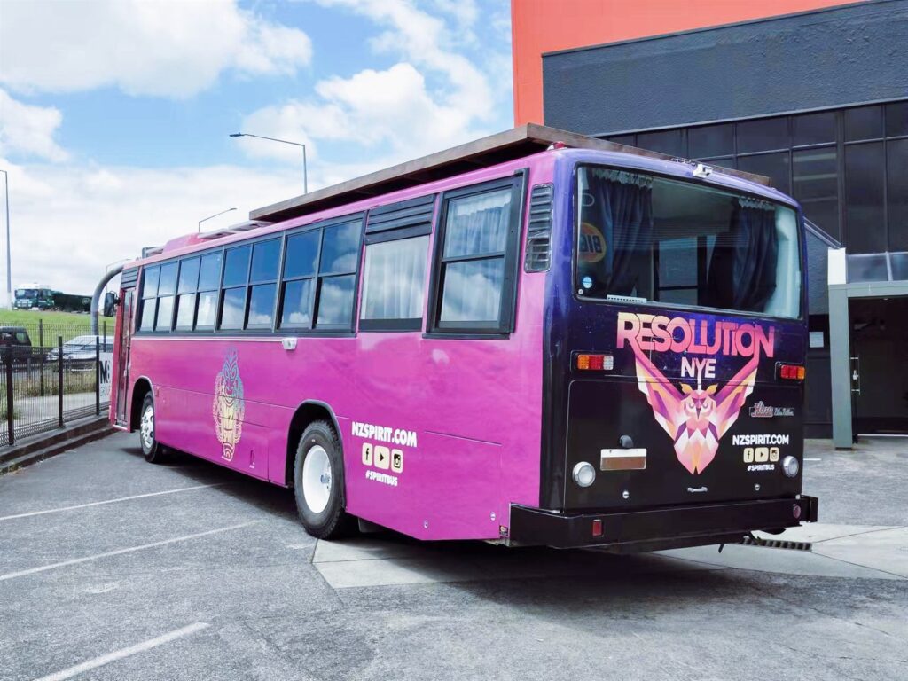 Bus wrapped end to end in printed vehicle graphics
