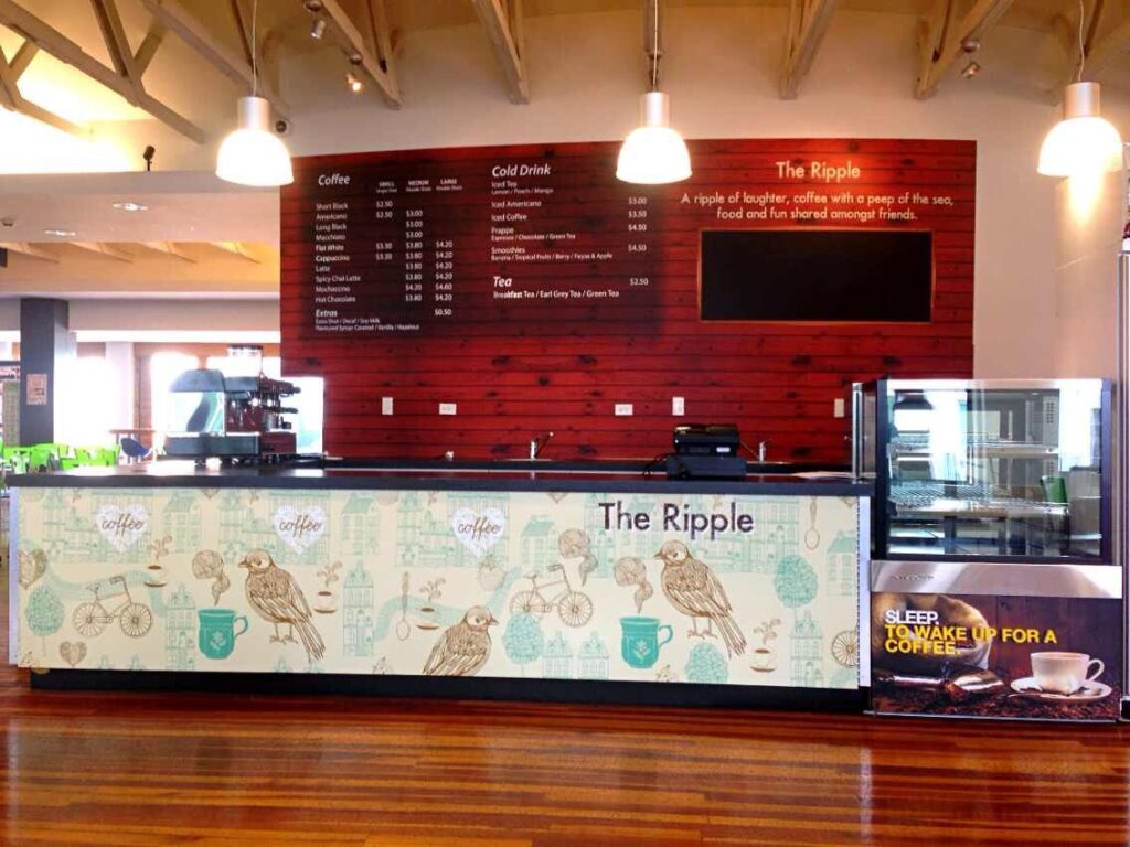 Cafe counter fitted out with printed panels and menu boards