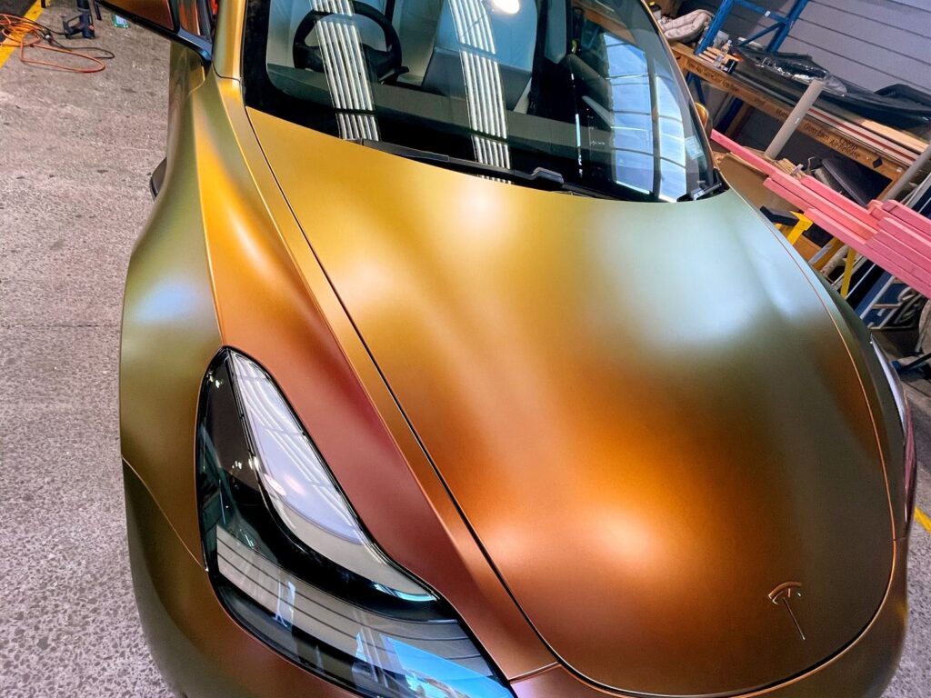 Car in a gold colour change wrap