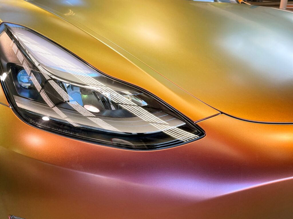 Close up of a colour shift wrap around a headlight