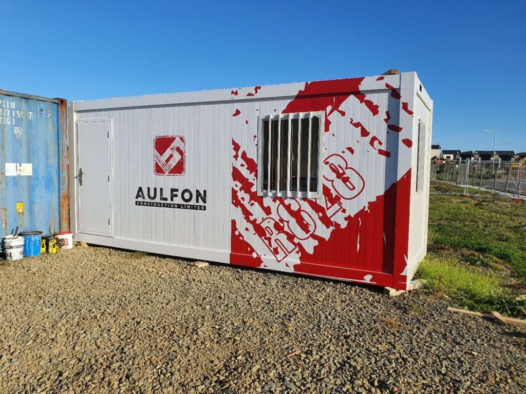 Shipping container wrapped in printed graphics