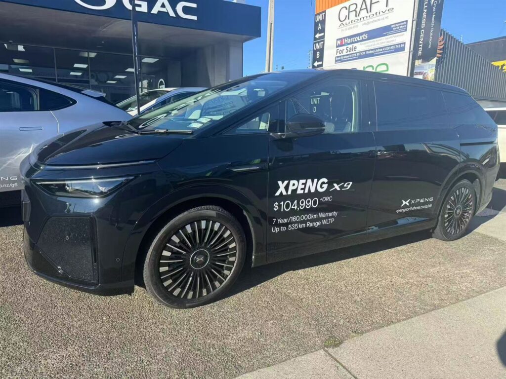 SUV with printed dealer graphics on the doors