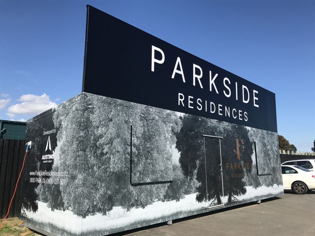 Large lettering and printed wall graphics on a building