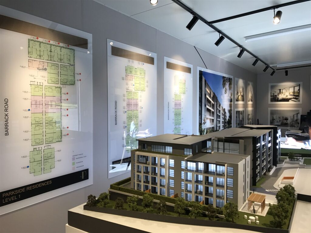 Sales suite fitted with site plans and a scale model