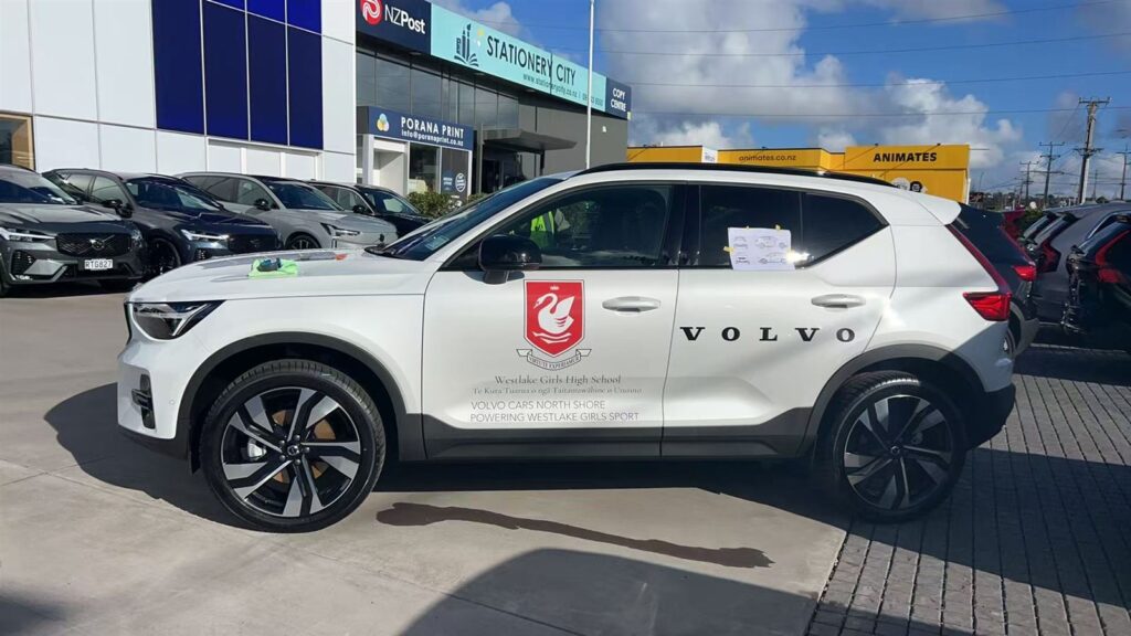 SUV with a printed crest and door graphics