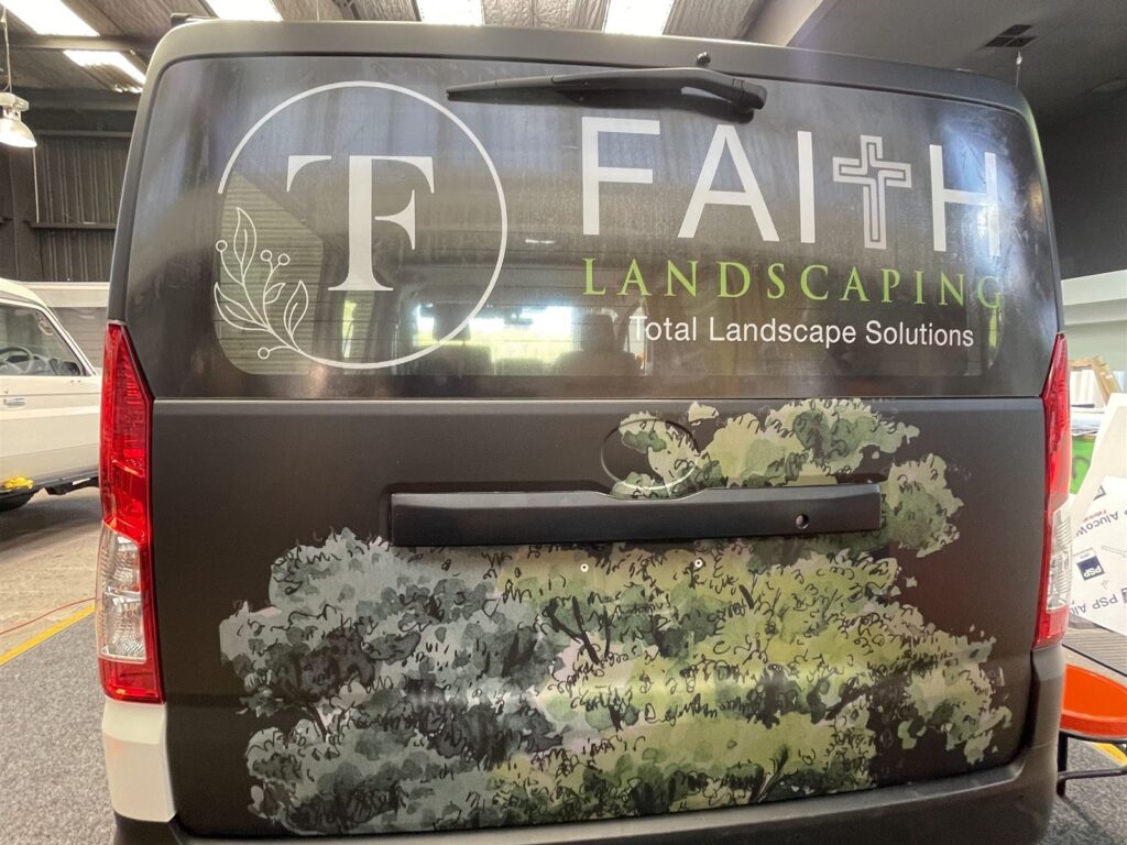 Van rear wrapped in printed landscape graphics