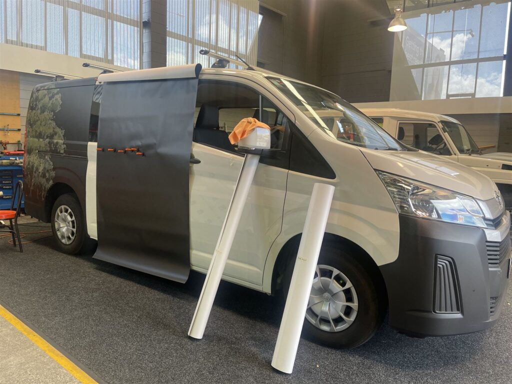 Van part way through a wrap install