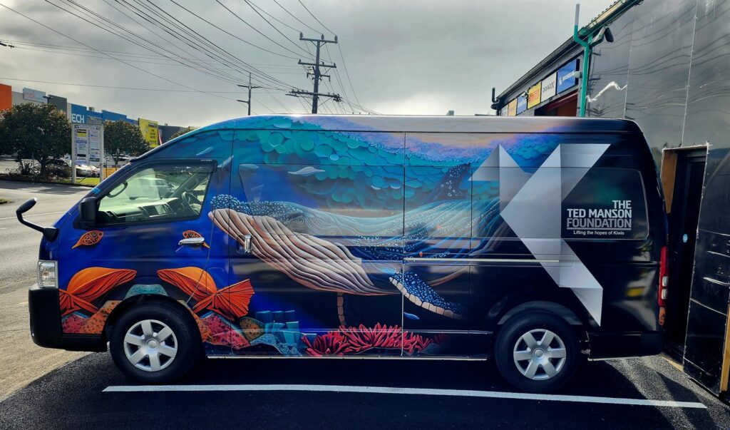 Van wrapped in a printed ocean artwork