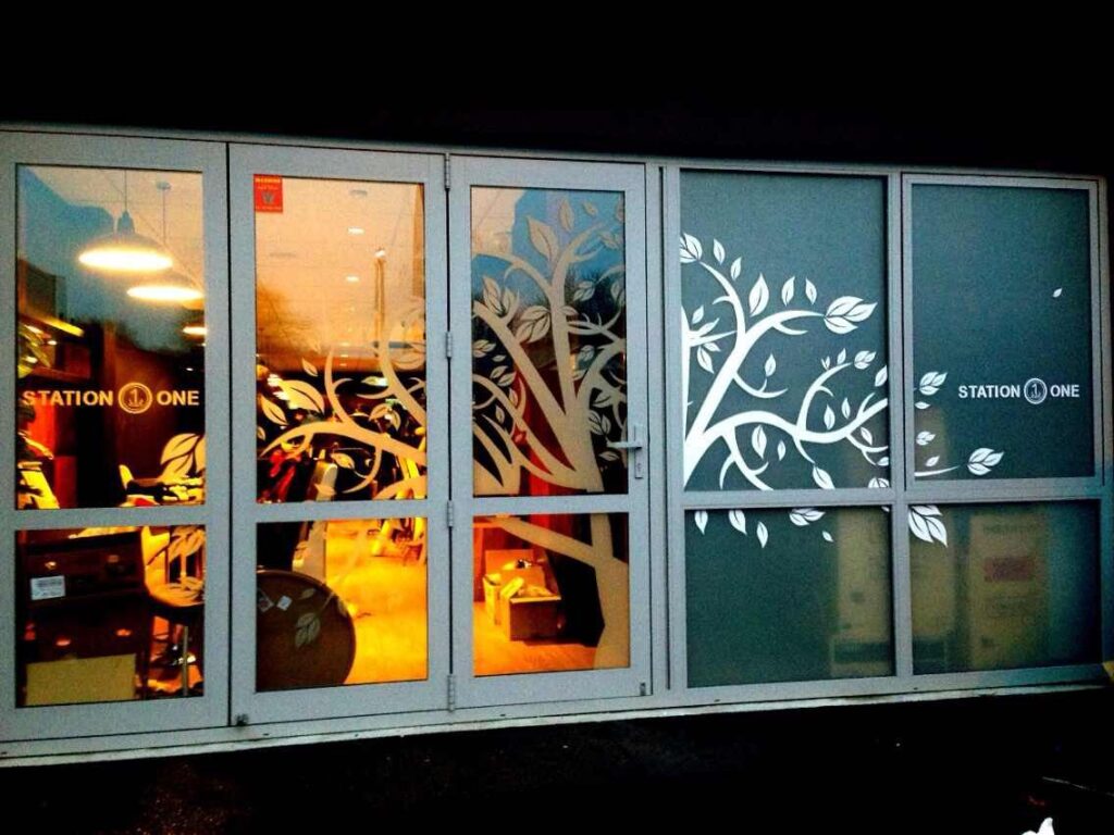 Printed window graphics lit up at night